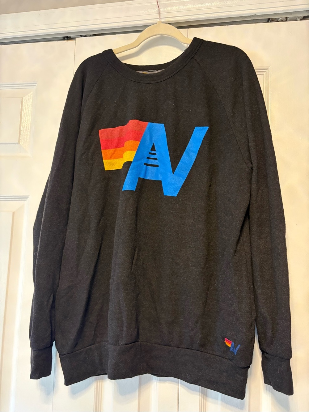 Aviator Nation Black Crewneck with Multicolor 'N' Logo and Rainbow Stripe